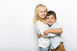 © Louis-Photo - Cute girl 4-5 year old with brother posing in studio