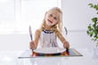 © Louis-Paul Photo - Little girl holding fork empty plate ready for food.