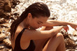 © forma82 - Beautiful girl is posing on the rocks and stones at the seaside.