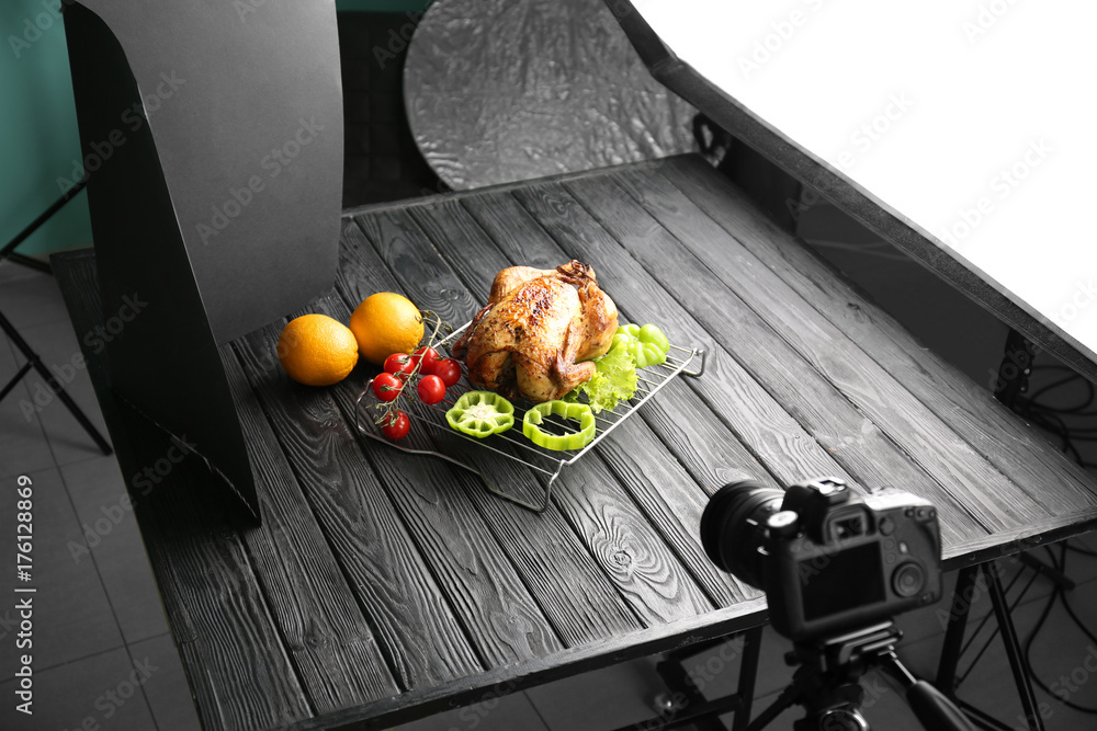 Photo studio with professional lighting equipment and camera for shooting food