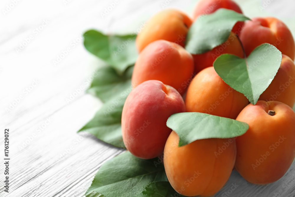 Fresh apricots on wooden table, closeup