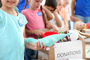 Sticker - Happy small volunteers sorting donation goods