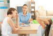 © Africa Studio - Young child psychologist working with family in office