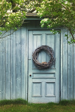 Old Blue Barn Door With Wreath