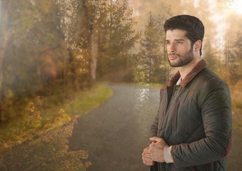 Wall Mural - Man standing in Autumn woods