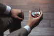 © eddiepearson/Stocksy - Dapper gentleman holding a glass of rum