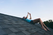 © sjlocke/Stocksy - Roof: Teen Girl Uses Cell Phone On The Rooftop Of A House