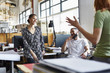 © altoimages/Stocksy - Business People Having Discussion In Office