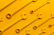 © Marko/Stocksy - Yellow wrench set on yellow background.