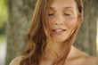 © eclaire/Stocksy - Beautiful young woman with eyes closed