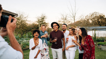 Wall Mural - Group of partying and posing for a photograph