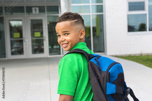 african american boy backpacks