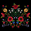 Embroidery traditional pattern with red poppies and roses.