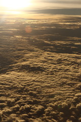 Wall Mural - Sunset White Cloud sky at high level attitude, view from window airplane