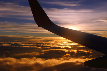 Wall Mural - Sunset White Cloud sky at high level attitude, view from window airplane