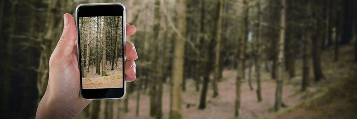 Wall Mural - Composite image of close-up of cropped hand holding phone