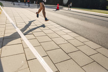 Low Section Of Runner On Pavement
