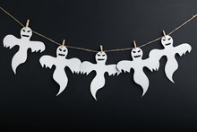 Halloween Ghosts Hanging On Black Background