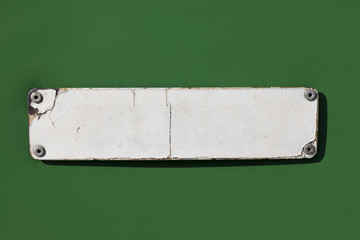 blank old iron information frame on green background