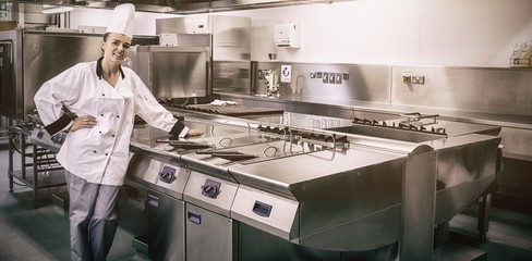 young chef standing next to work surface