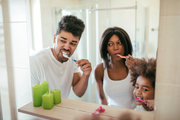 Wall Mural - She knows how important brushing her teeth is