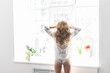 © speed300 - Young pretty woman standing at opened window and looking outside enjoys of rest