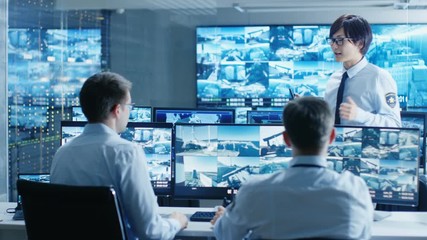 Aufkleber - In the Security Control Room Chief Surveillance Officer Briefs Two of His Subordinates. Multiple Screens Show that They Guard Object of Big Importance. 