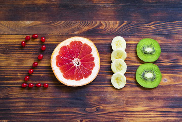 Wall Mural - happy new year 2018 of fruit and berries on wooden background.