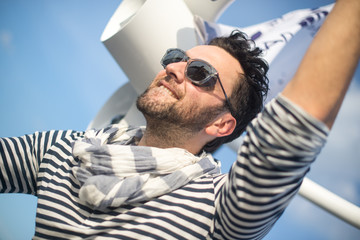 Portrait of a handsome man on a yacht