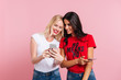 © Drobot Dean - Picture of Two pretty happy women using her smartphones