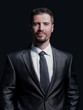 © ASDF - Handsome mature business man isolated on black background