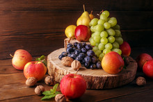 Still Life Of Fruit, Apples, Pears, Grapes And Nuts. The Concept Is Healthy Food, Vegetarianism, Vitamins.