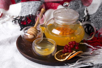 Wall Mural - tray with honey and a cup of hot tea in the bed,