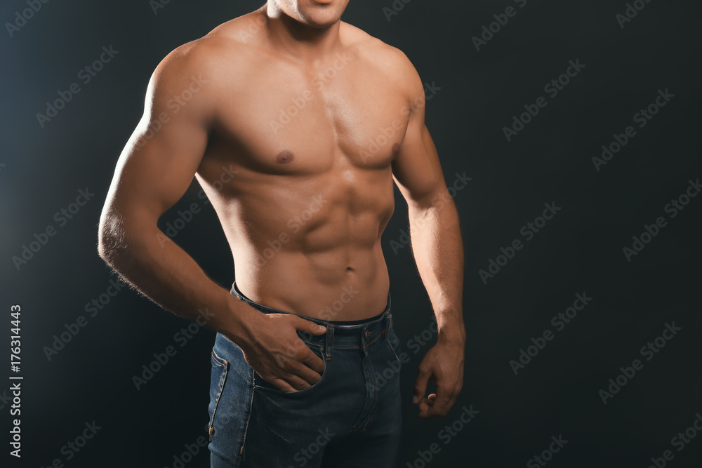 Muscular man on dark background