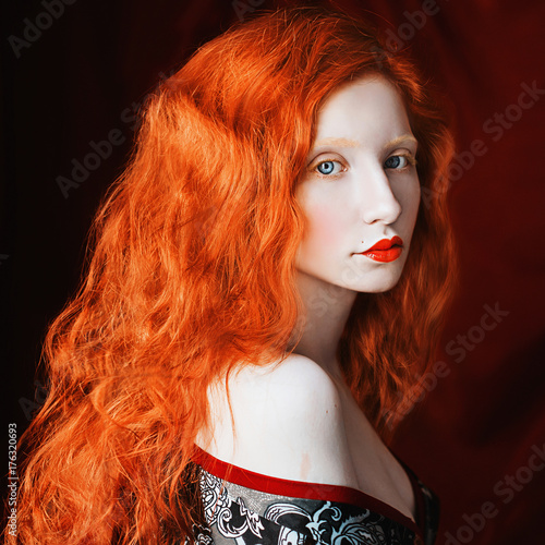 Red Haired Girl With Curly Hair With Pale Skin In A Dressing Gown