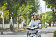 © Odua Images - woman riding a motorcyle or motorbike