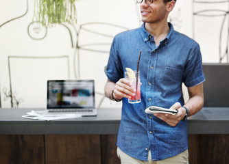 Wall Mural - restaurant manager with a drink in his hand