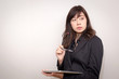 © PRASERT - Business woman using a touch pad (tablet). concept for business.