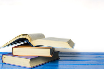 Closeup hardcover book isolated on white background. Selective focus.