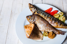 Assortment Of Fried Fasting Fish, Mackerel, Trout, Carp. Top View On Grilled Seafood Variety. Mediterranean Cuisine, Healthy Food, Restaurant Menu, Buffet Concept. Grilles Fish In Plate