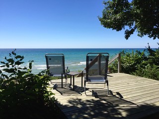 outdoor chairs to sit in and look out at the water