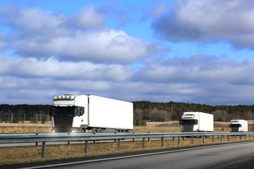 Sticker - Three White Semi Trucks Platoon on Freeway