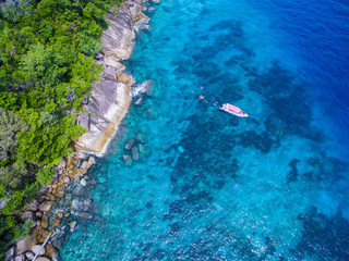 Wall Mural - Aerial view of isolated tropical island with blue clear water and granite stones. Top view of coral reef at Similan Islands, Thailand.