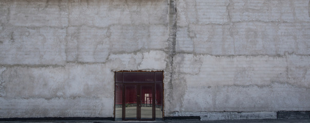 Wall Mural - abstract cement dirty wall, old concrete wall with a door