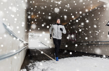 Man Running Along Subway Tunnel In Winter