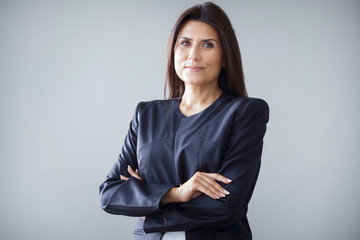 portrait of businesswoman on grey background