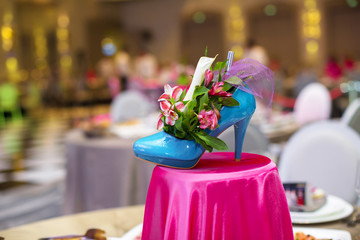 flowers in the blue sky women's shoes, on the table