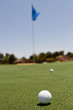© Jayme Burrows Photography/Stocksy - Close-up of a golf ball on a golf course