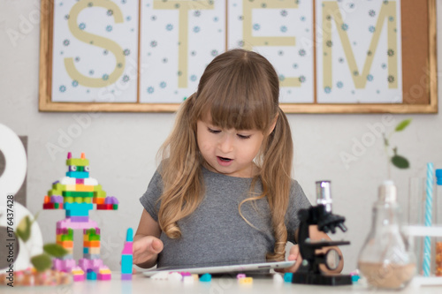 Little Girl Is Behind The Desk Microscope The Tree Little Robot