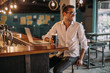 © Studio Firma/Stocksy - Stylish man working in a restaurant.